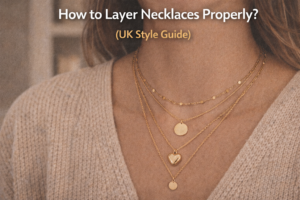 Layered silver necklaces worn together showing different chain lengths